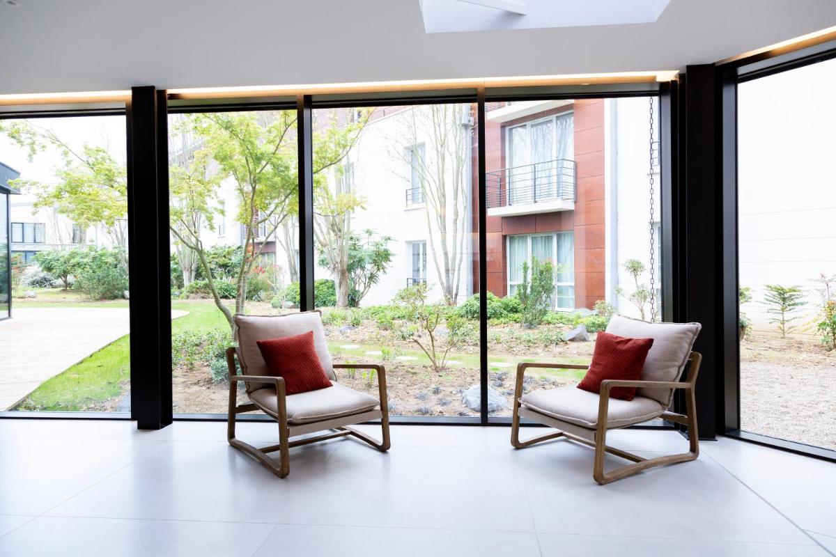Coin salon dans l'établissement Paxton Paris MLV