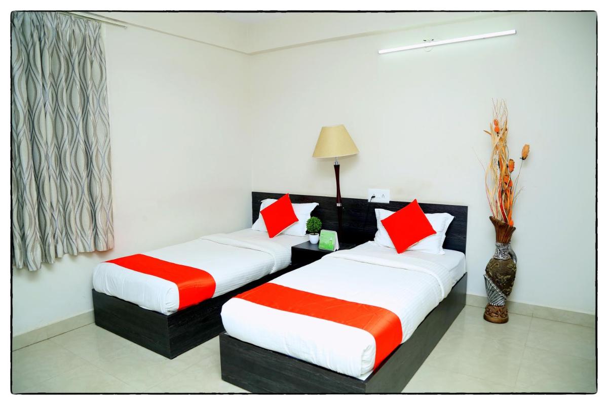 Orange Corner Hotel, Airport pickup & drop Available 24X7 - Housity