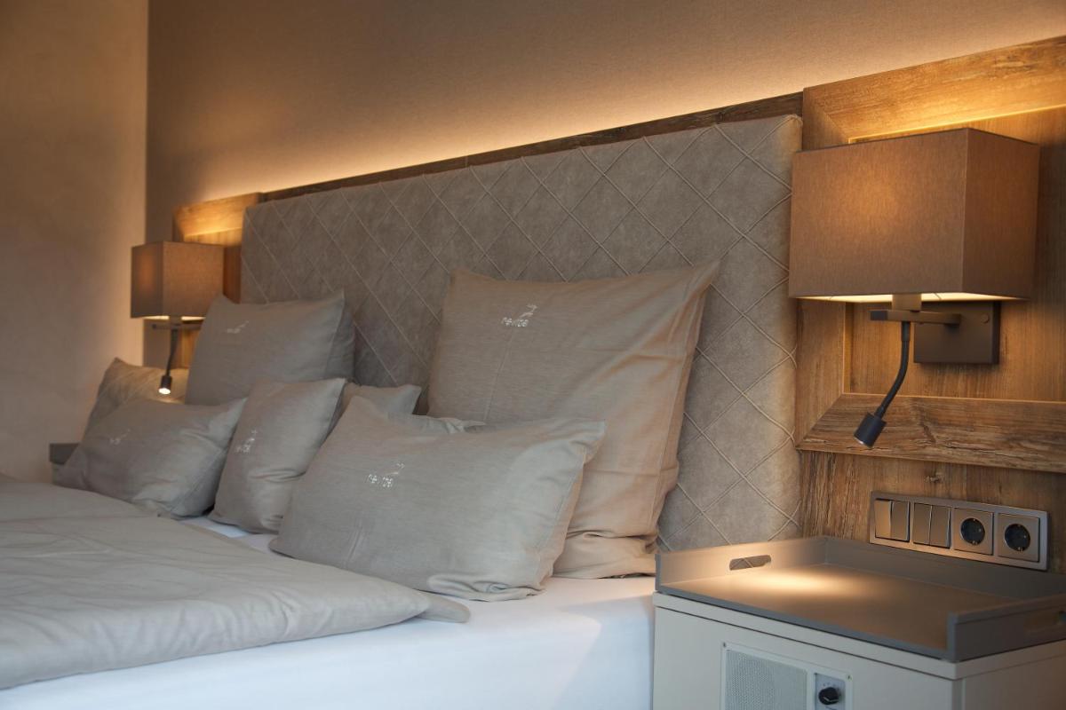 Ein Bett oder Betten in einem Zimmer der Unterkunft revita - naturresort & spa