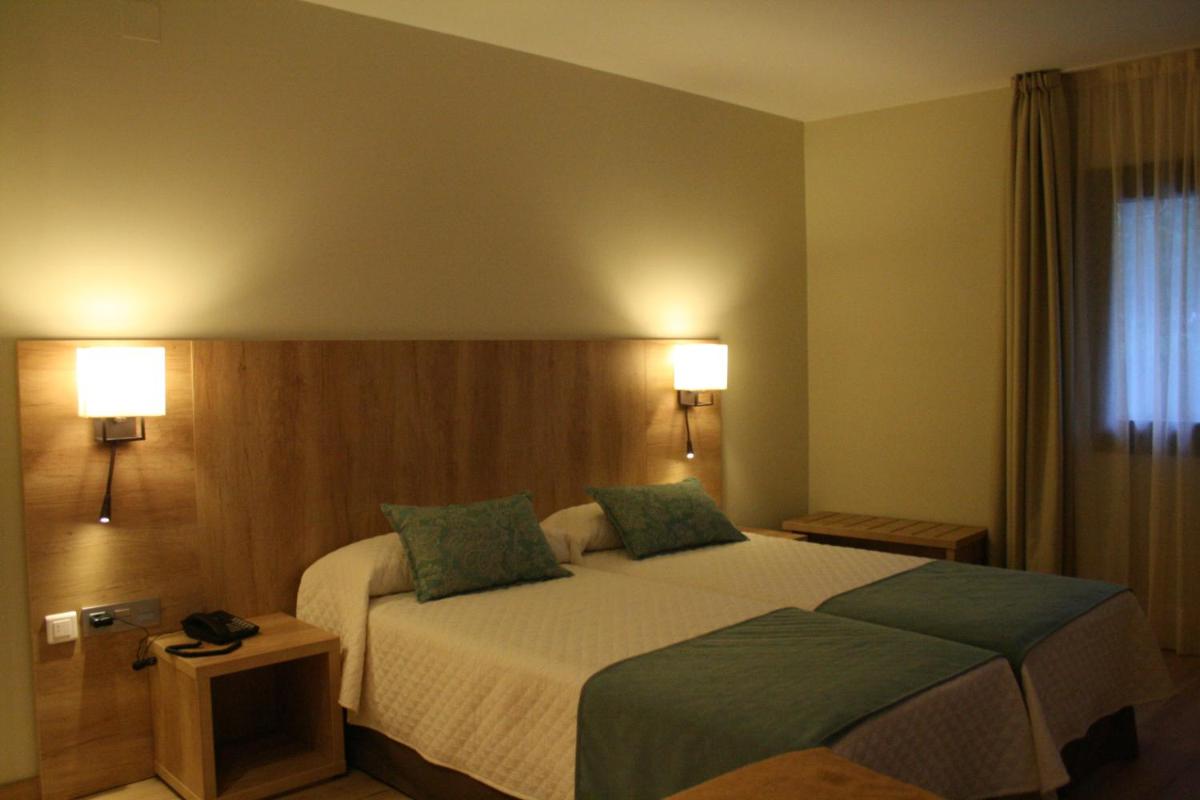 Cama o camas de una habitación en Hotel & Spa Real Villa Anayet