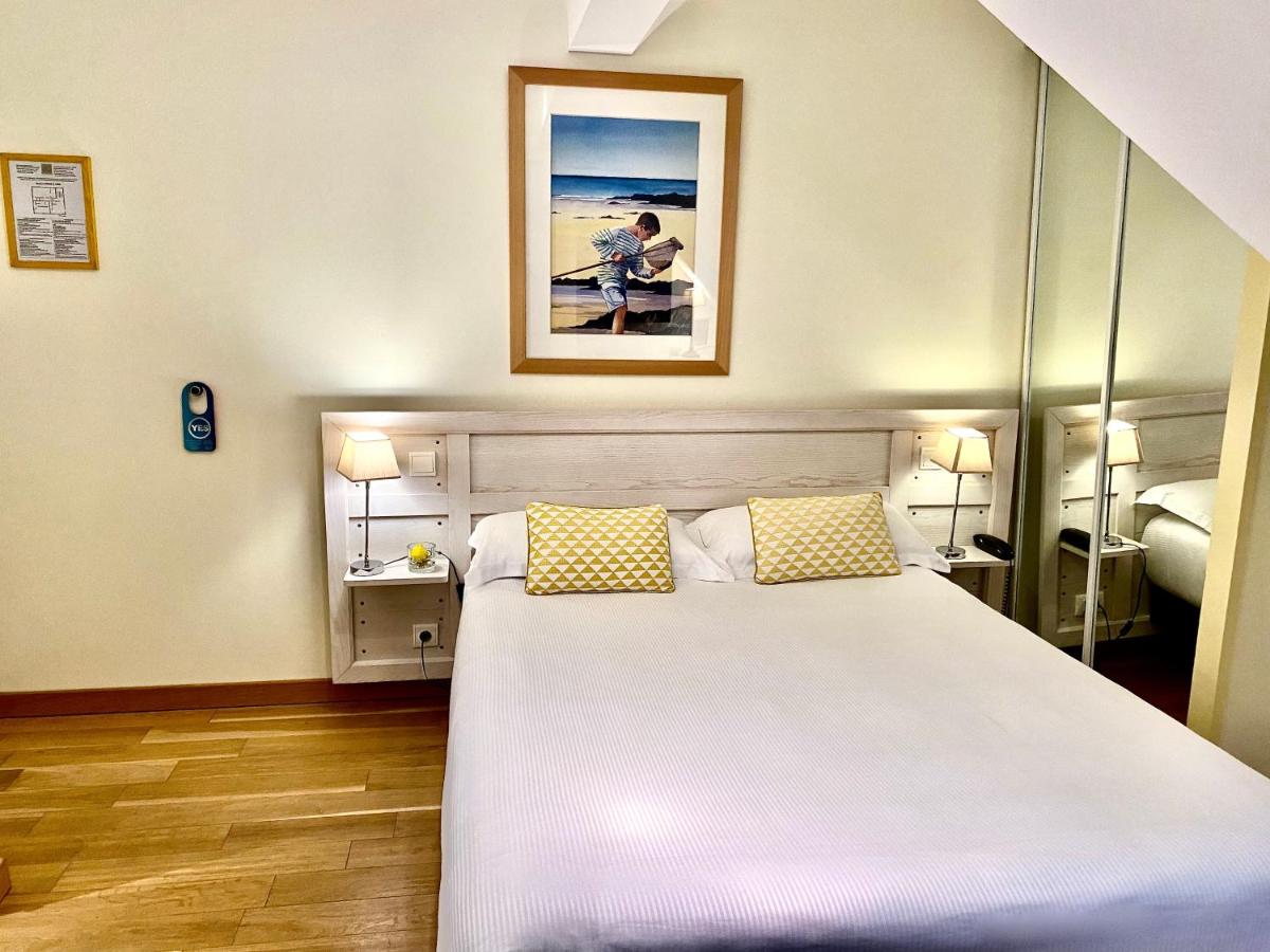 Un ou plusieurs lits dans un hébergement de l'établissement Hôtel Lutétia & Spa