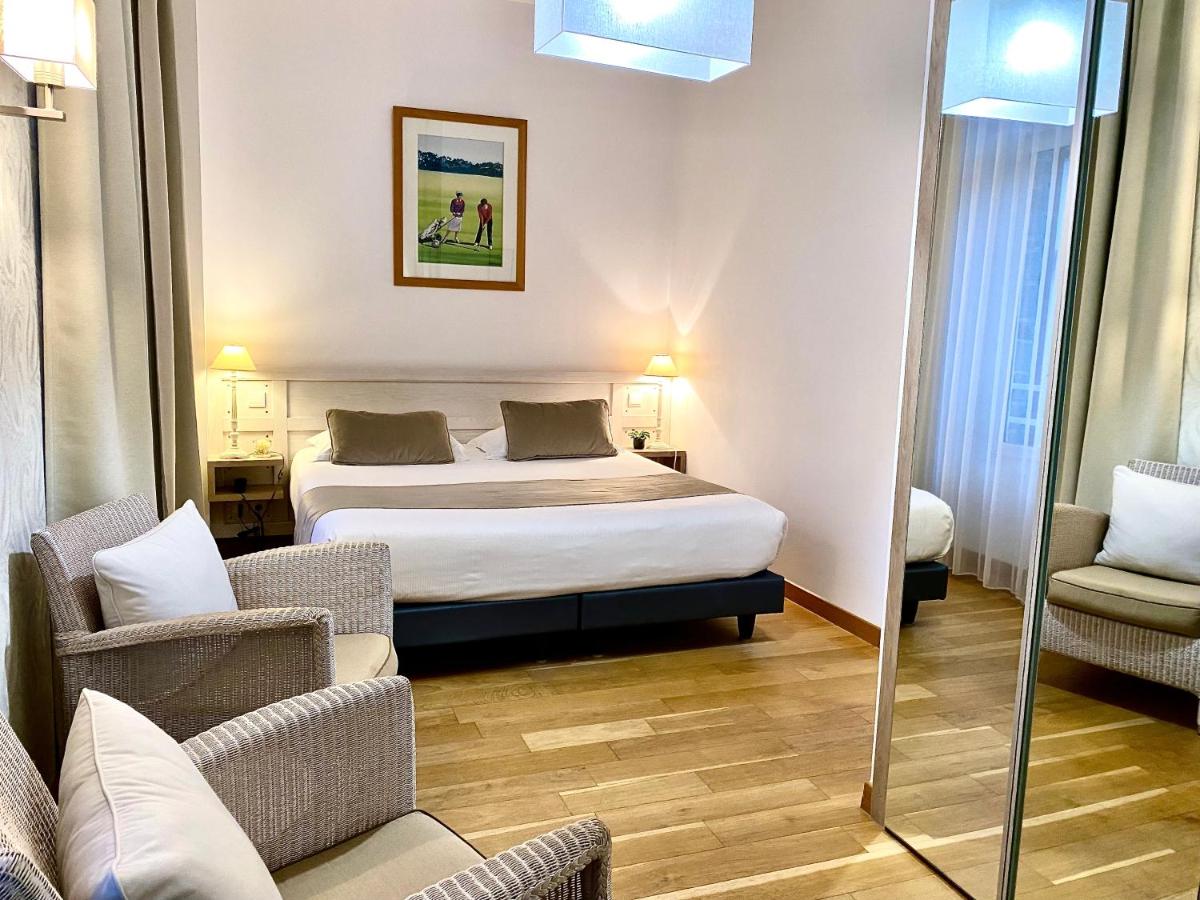 Un ou plusieurs lits dans un hébergement de l'établissement Hôtel Lutétia & Spa