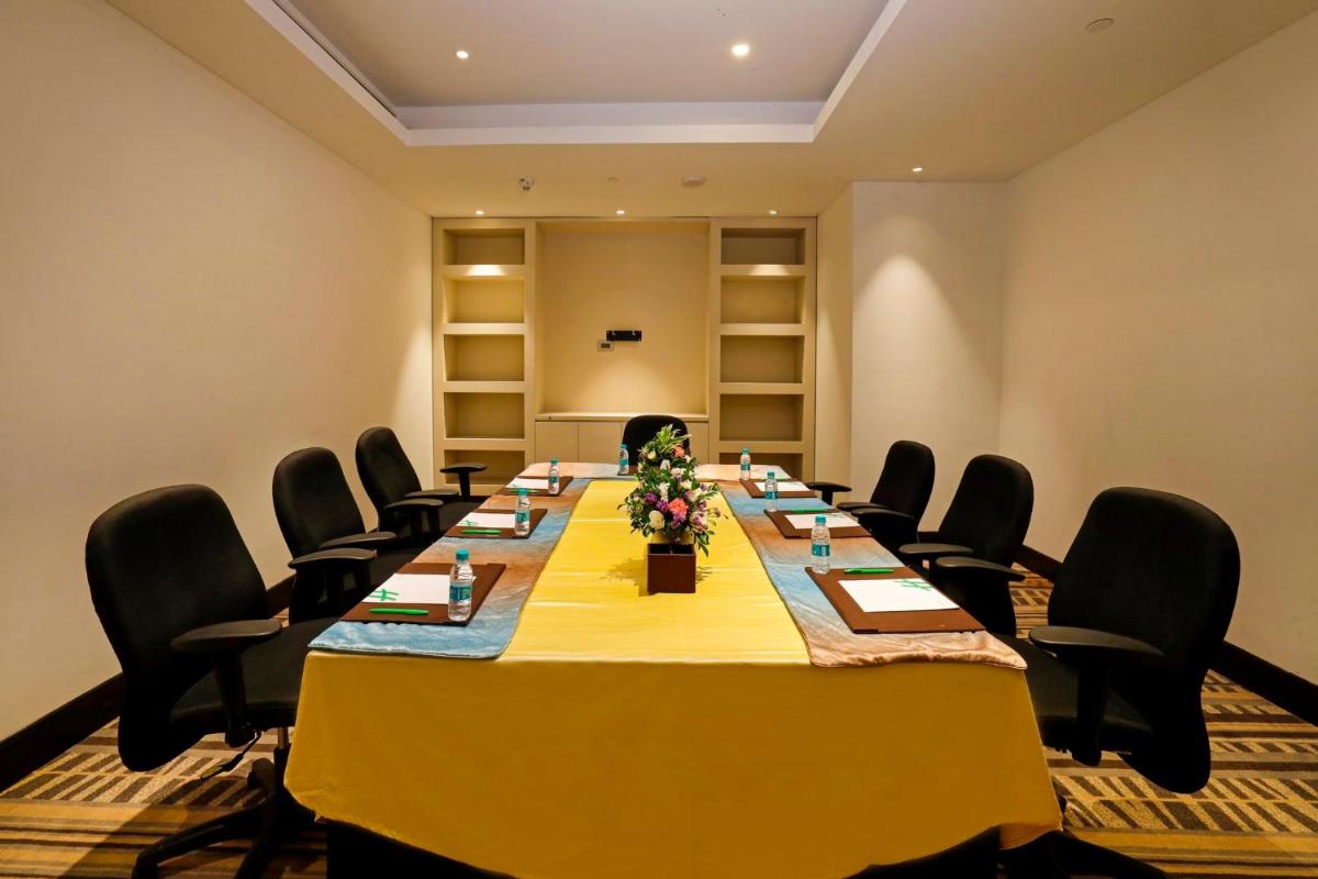a conference room with a long table and chairs at Holiday Inn Chennai OMR IT Expressway by IHG in Chennai