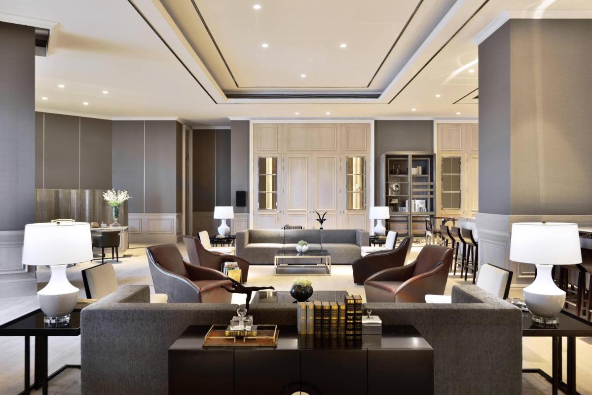 a large living room with couches and chairs at JW Marriott Hotel Kolkata in Kolkata