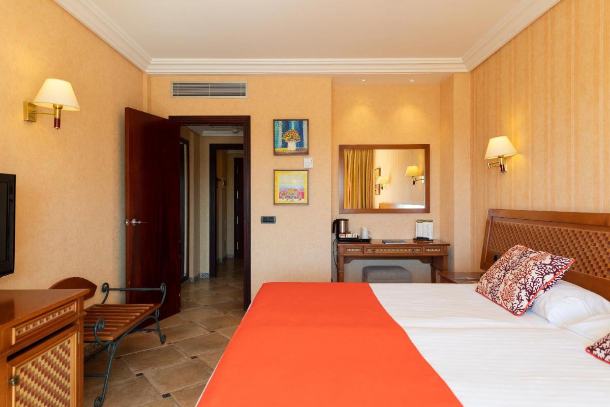 Cama o camas de una habitación en Hotel Cordial Mogán Playa
