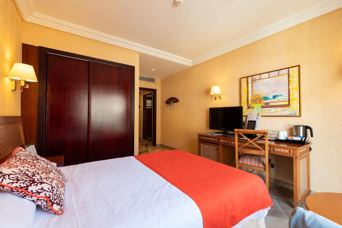 Cama o camas de una habitación en Hotel Cordial Mogán Playa