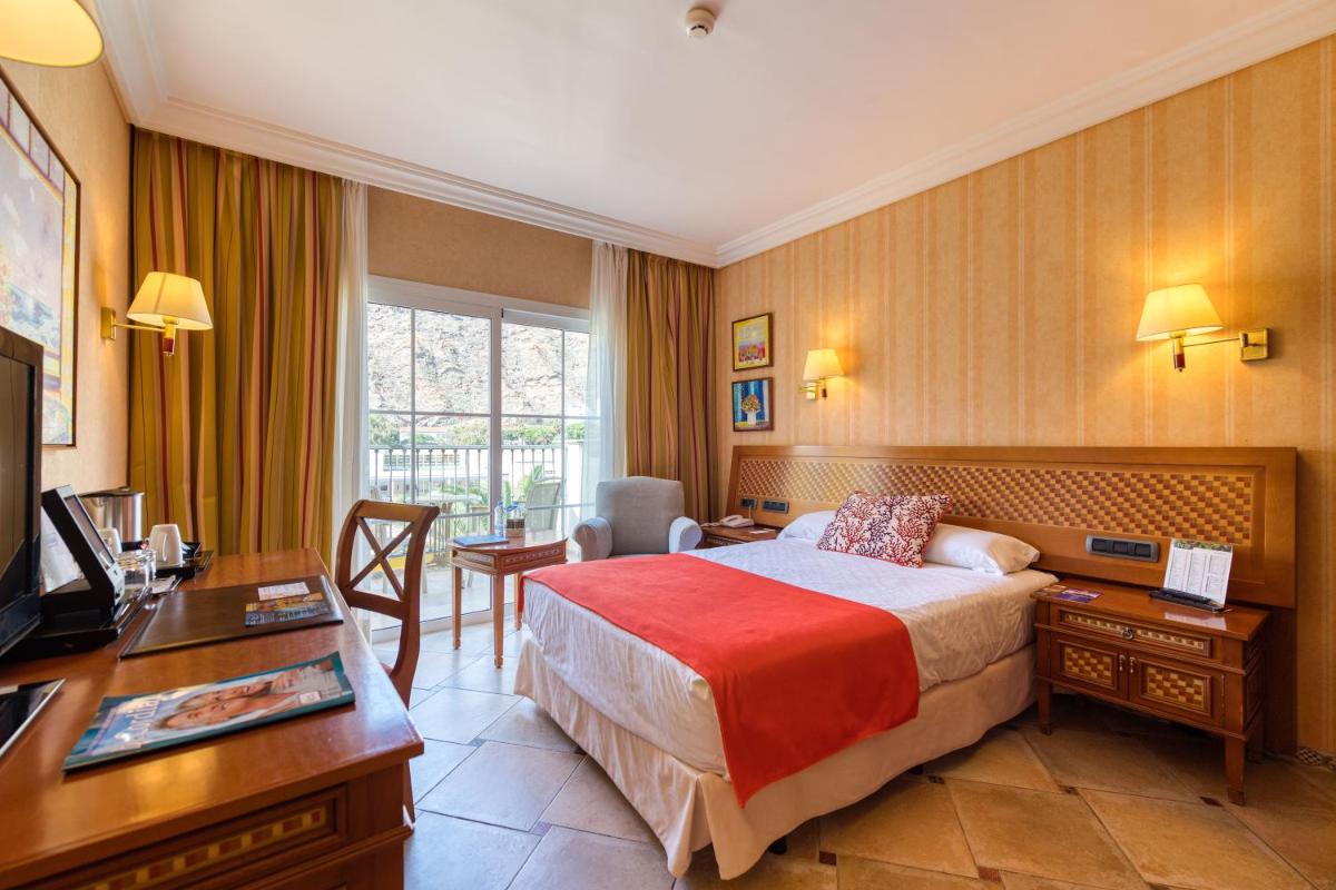 Cama o camas de una habitación en Hotel Cordial Mogán Playa
