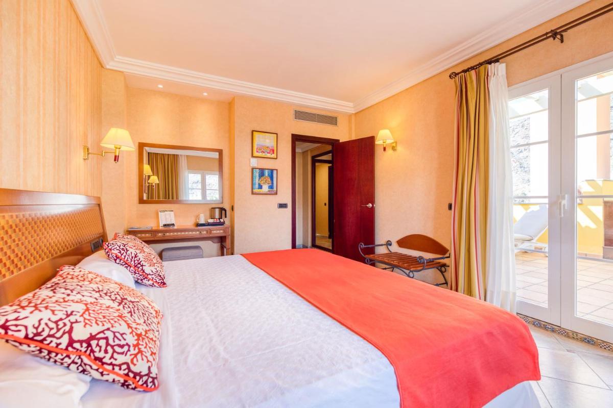 Cama o camas de una habitación en Hotel Cordial Mogán Playa