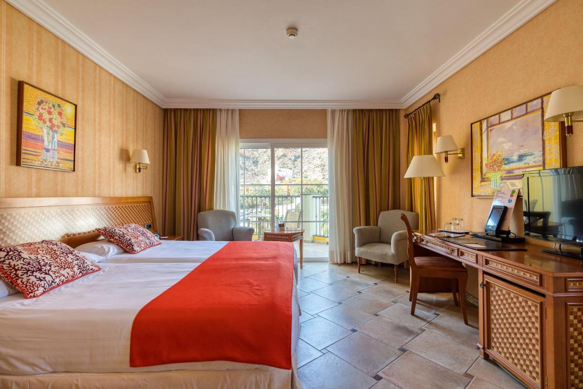 Cama o camas de una habitación en Hotel Cordial Mogán Playa