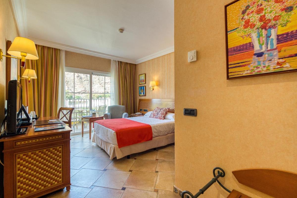 Cama o camas de una habitación en Hotel Cordial Mogán Playa