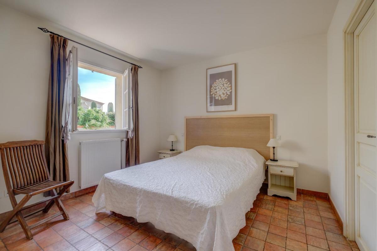 Un ou plusieurs lits dans un hébergement de l'établissement Les Appartements et Maisons du Domaine de Saint Endréol Golf & Spa Resort