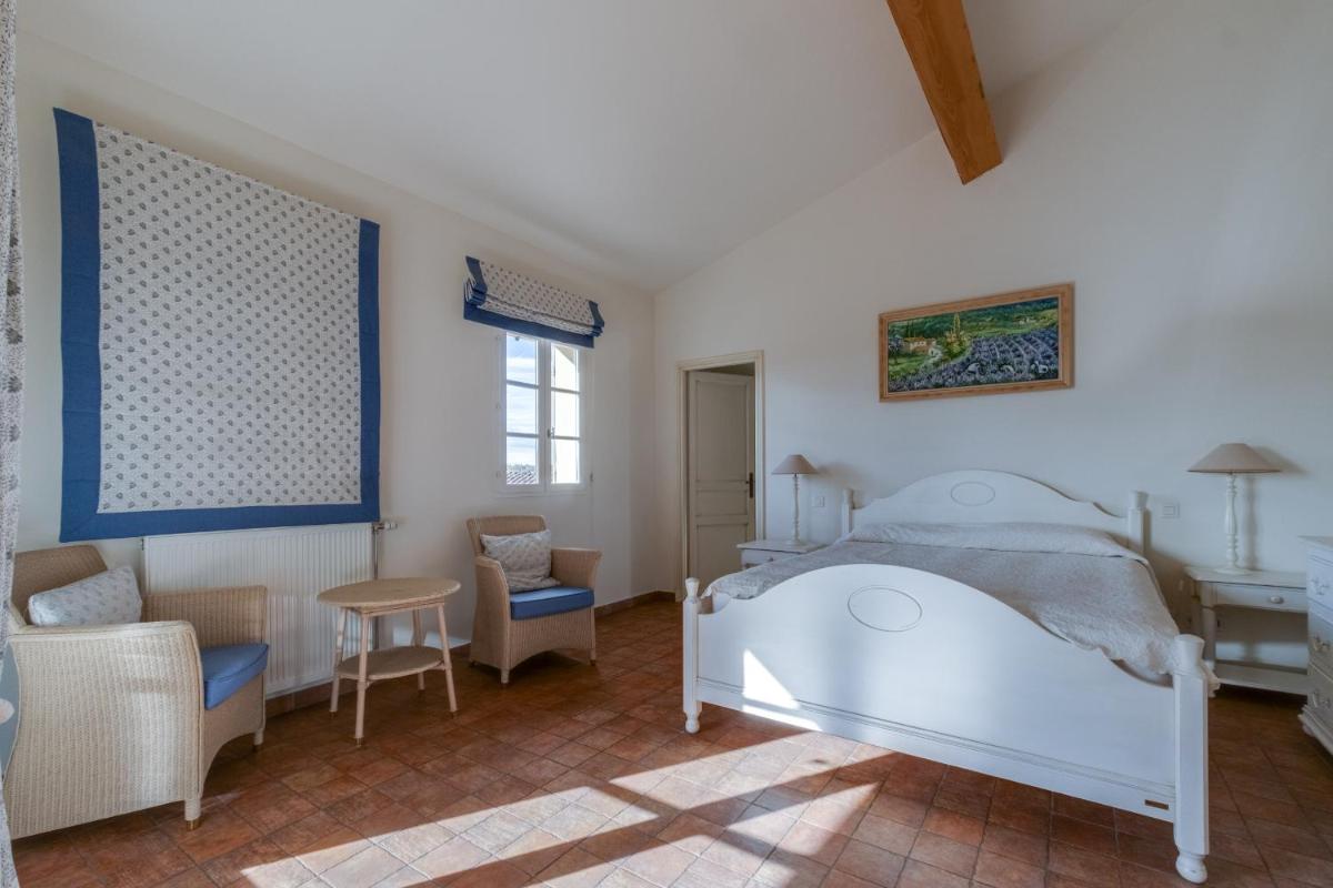Un ou plusieurs lits dans un hébergement de l'établissement Les Appartements et Maisons du Domaine de Saint Endréol Golf & Spa Resort