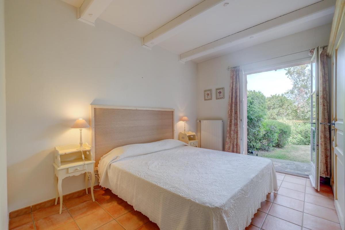 Un ou plusieurs lits dans un hébergement de l'établissement Les Appartements et Maisons du Domaine de Saint Endréol Golf & Spa Resort