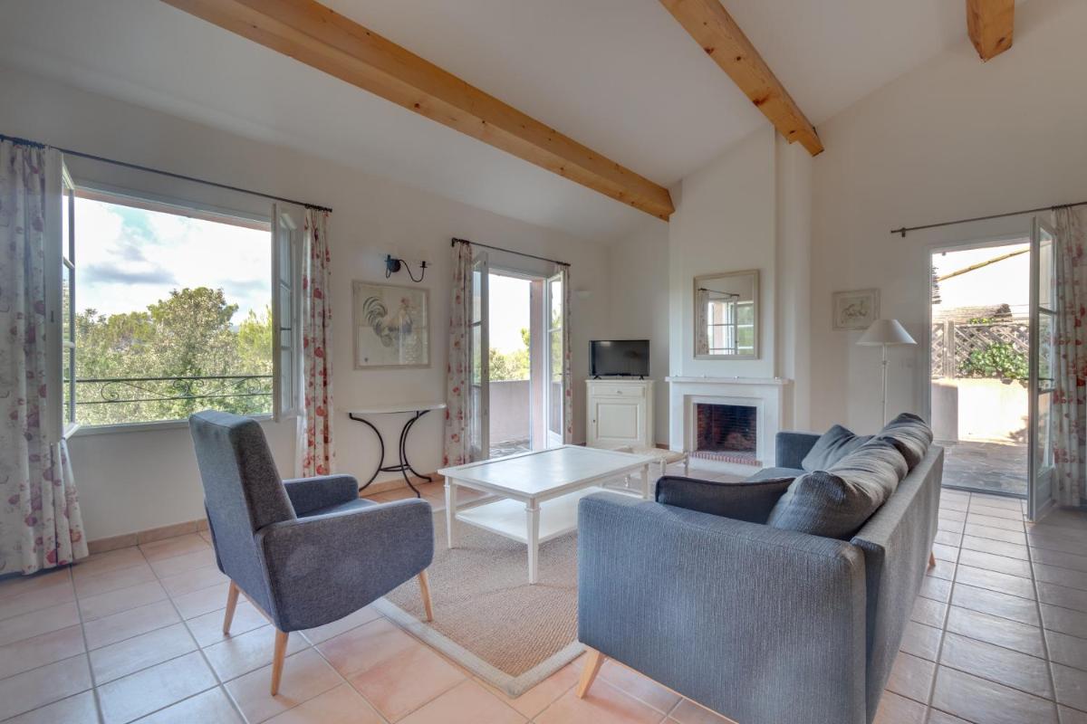 Coin salon dans l'établissement Les Appartements et Maisons du Domaine de Saint Endréol Golf & Spa Resort