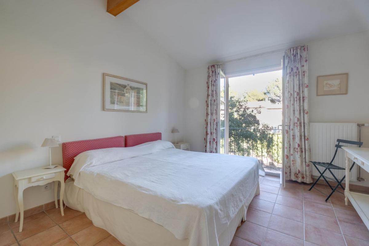 Un ou plusieurs lits dans un hébergement de l'établissement Les Appartements et Maisons du Domaine de Saint Endréol Golf & Spa Resort