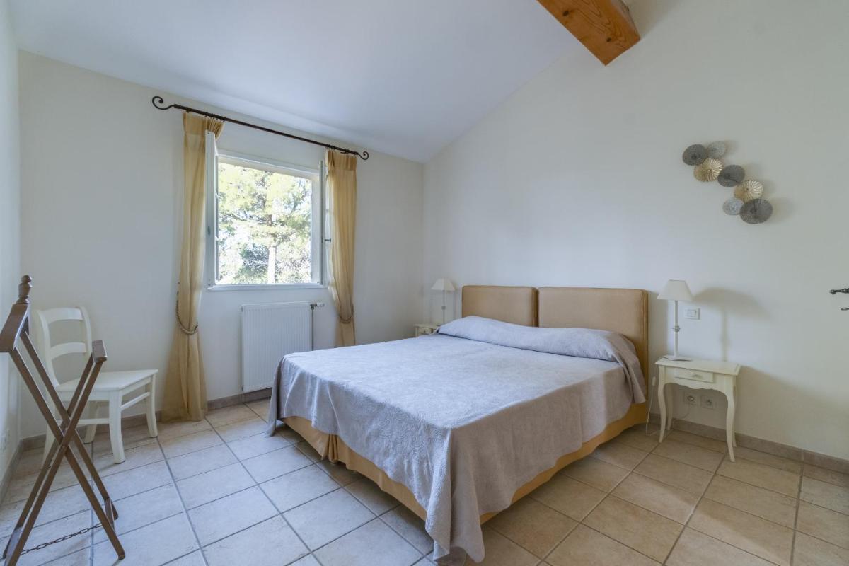 Un ou plusieurs lits dans un hébergement de l'établissement Les Appartements et Maisons du Domaine de Saint Endréol Golf & Spa Resort
