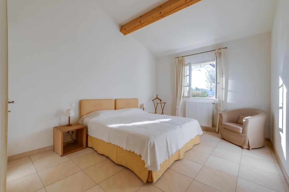 Un ou plusieurs lits dans un hébergement de l'établissement Les Appartements et Maisons du Domaine de Saint Endréol Golf & Spa Resort