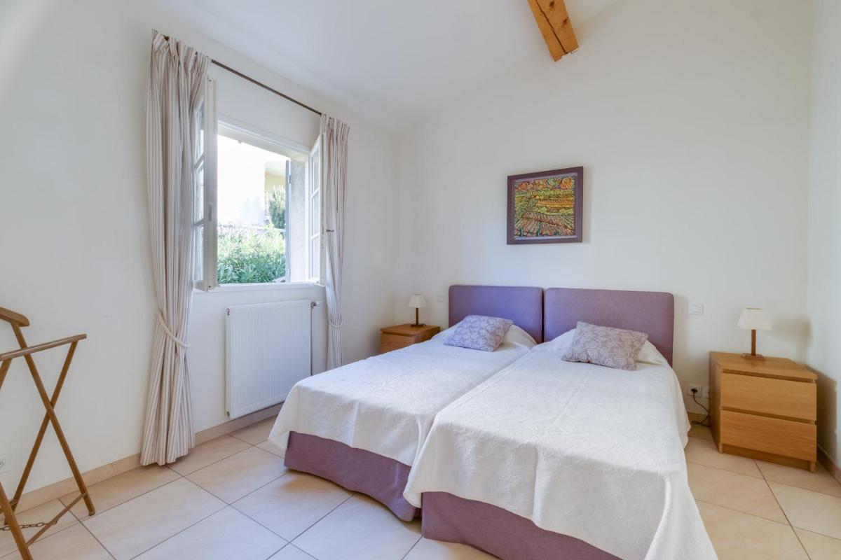 Un ou plusieurs lits dans un hébergement de l'établissement Les Appartements et Maisons du Domaine de Saint Endréol Golf & Spa Resort