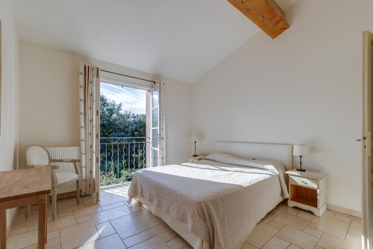 Un ou plusieurs lits dans un hébergement de l'établissement Les Appartements et Maisons du Domaine de Saint Endréol Golf & Spa Resort