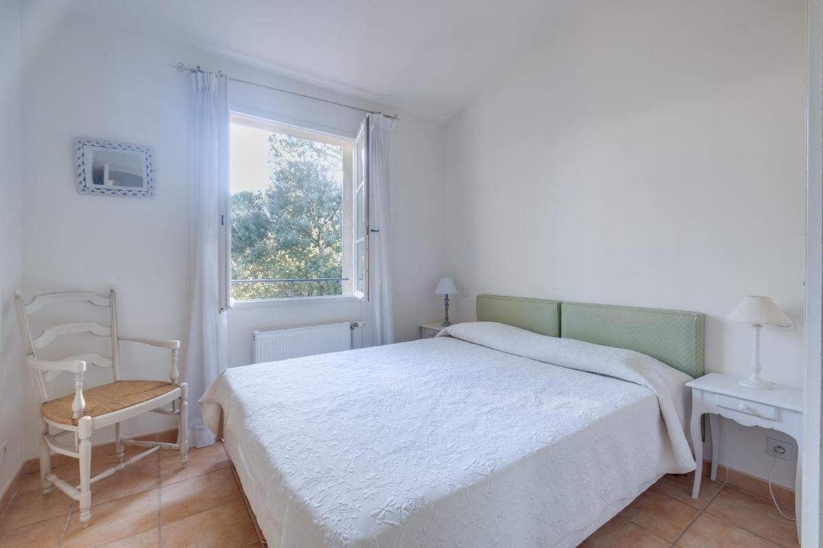 Un ou plusieurs lits dans un hébergement de l'établissement Les Appartements et Maisons du Domaine de Saint Endréol Golf & Spa Resort