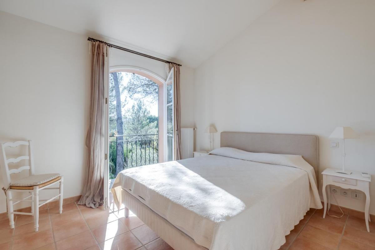 Un ou plusieurs lits dans un hébergement de l'établissement Les Appartements et Maisons du Domaine de Saint Endréol Golf & Spa Resort