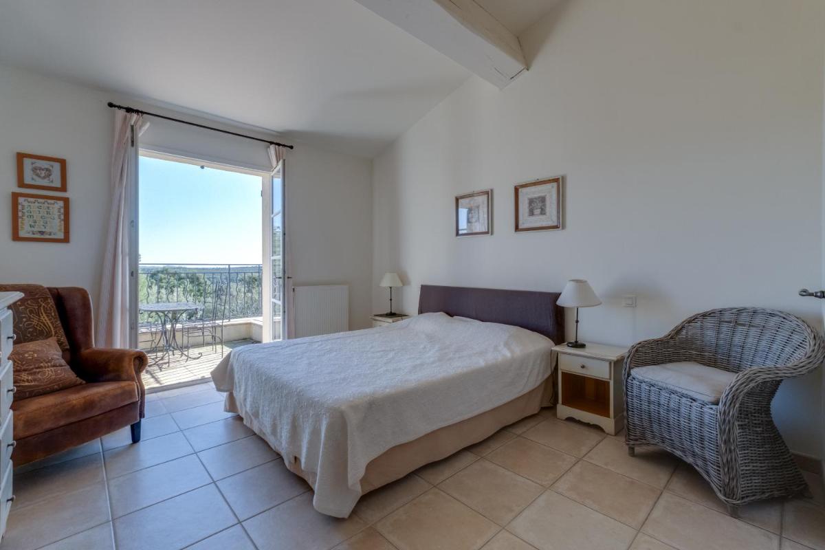 Un ou plusieurs lits dans un hébergement de l'établissement Les Appartements et Maisons du Domaine de Saint Endréol Golf & Spa Resort
