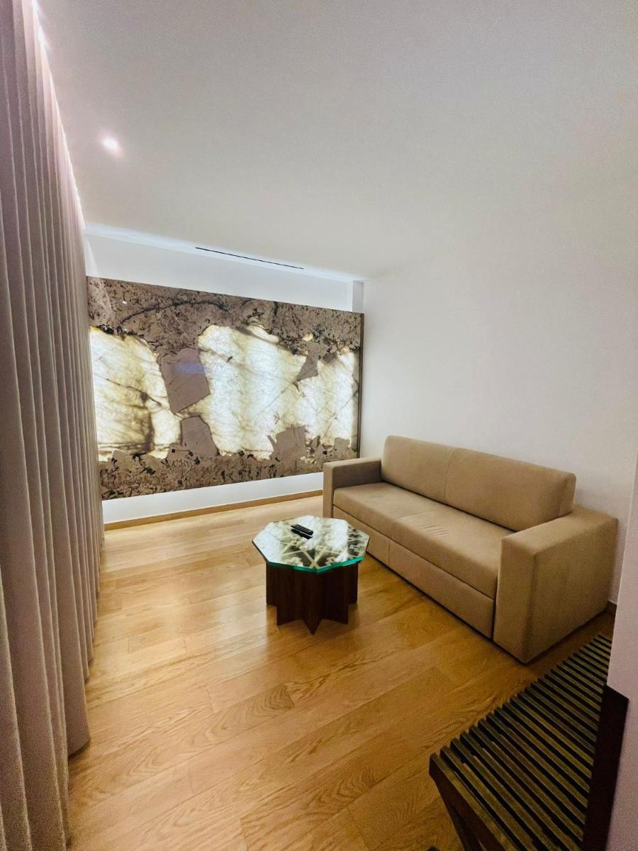 Uma área de estar em Castelo Hotel