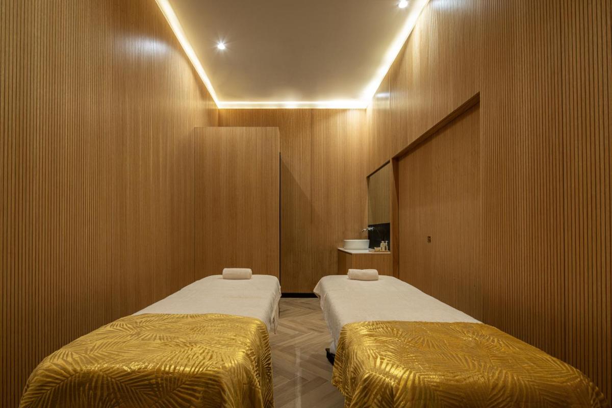 Uma cama ou camas num quarto em MS Collection Aveiro - Palacete Valdemouro