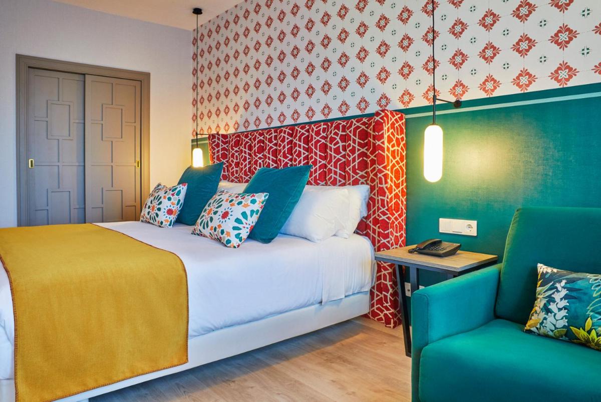 Cama o camas de una habitación en Hesperia Sevilla