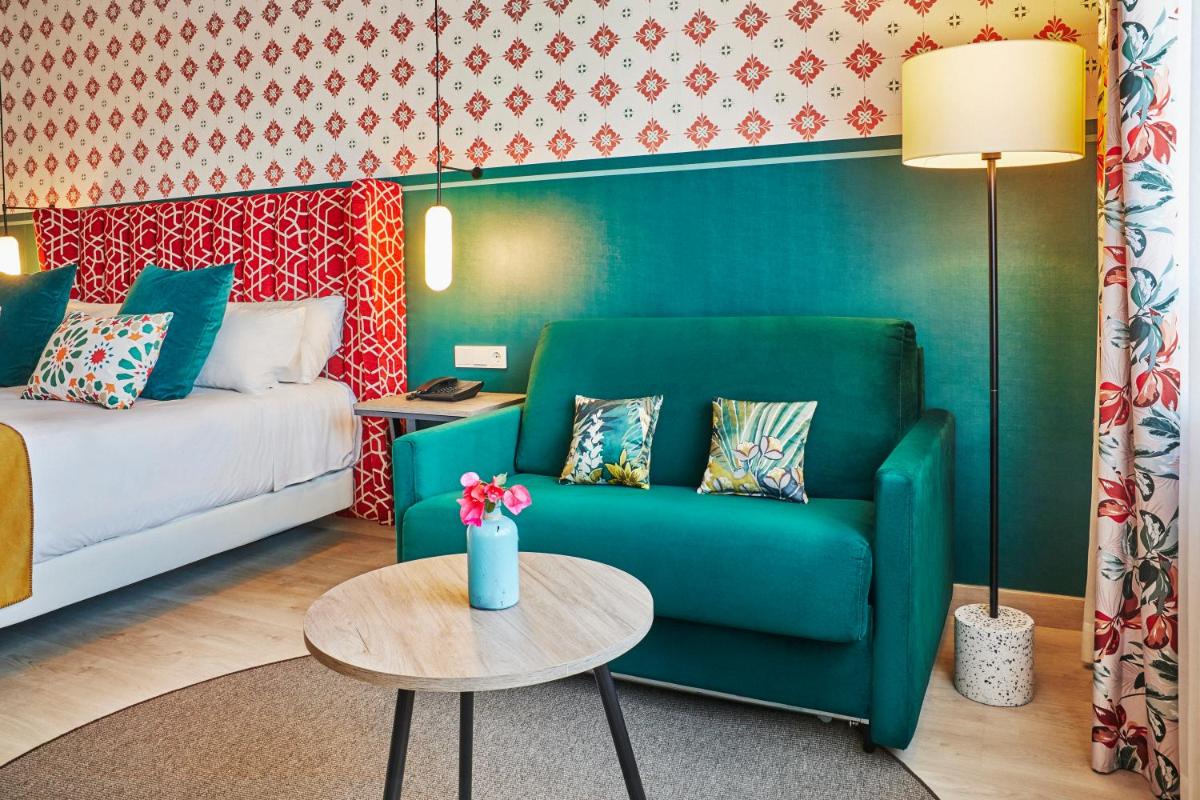 Cama o camas de una habitación en Hesperia Sevilla