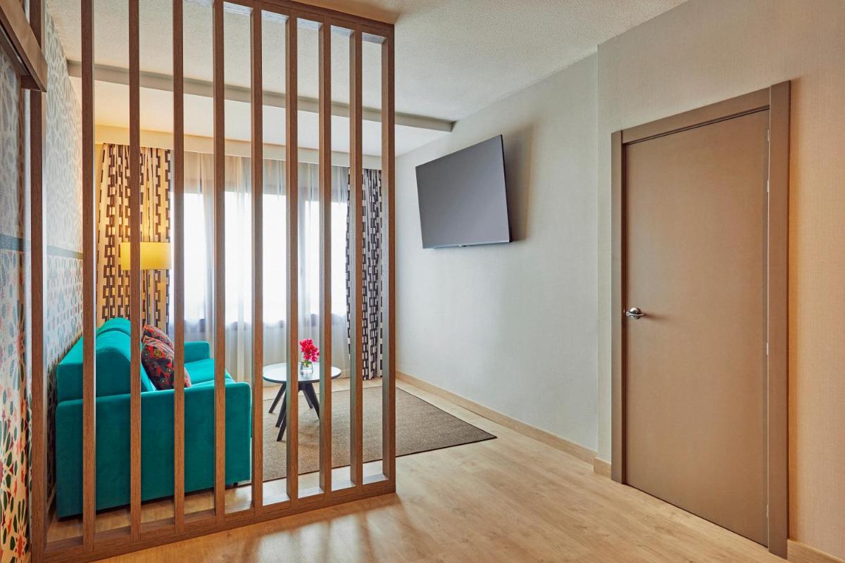 Cama o camas de una habitación en Hesperia Sevilla