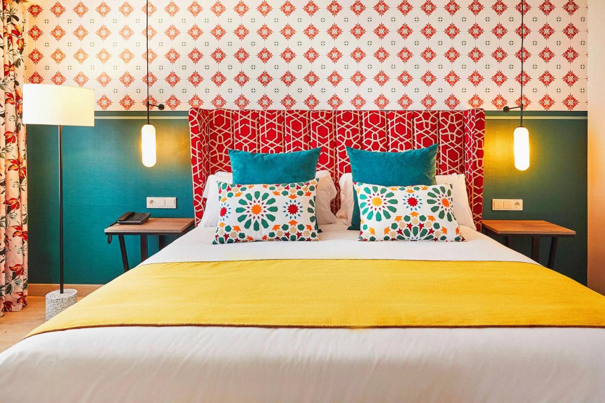 Cama o camas de una habitación en Hesperia Sevilla