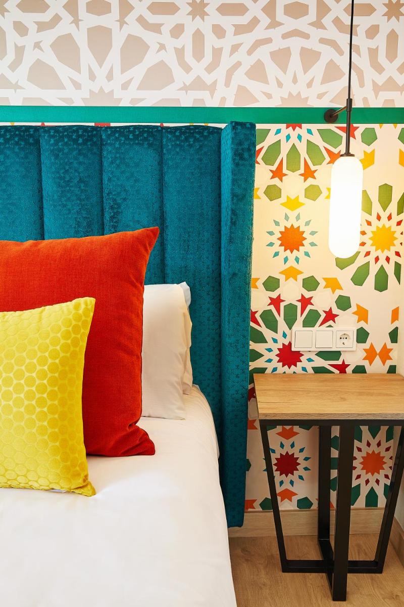 Cama o camas de una habitación en Hesperia Sevilla