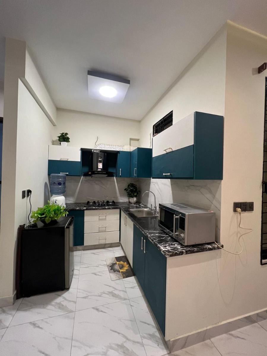 Travellers Heaven 3BR APT DHA PHASE VI Nishat Commercial - Housity