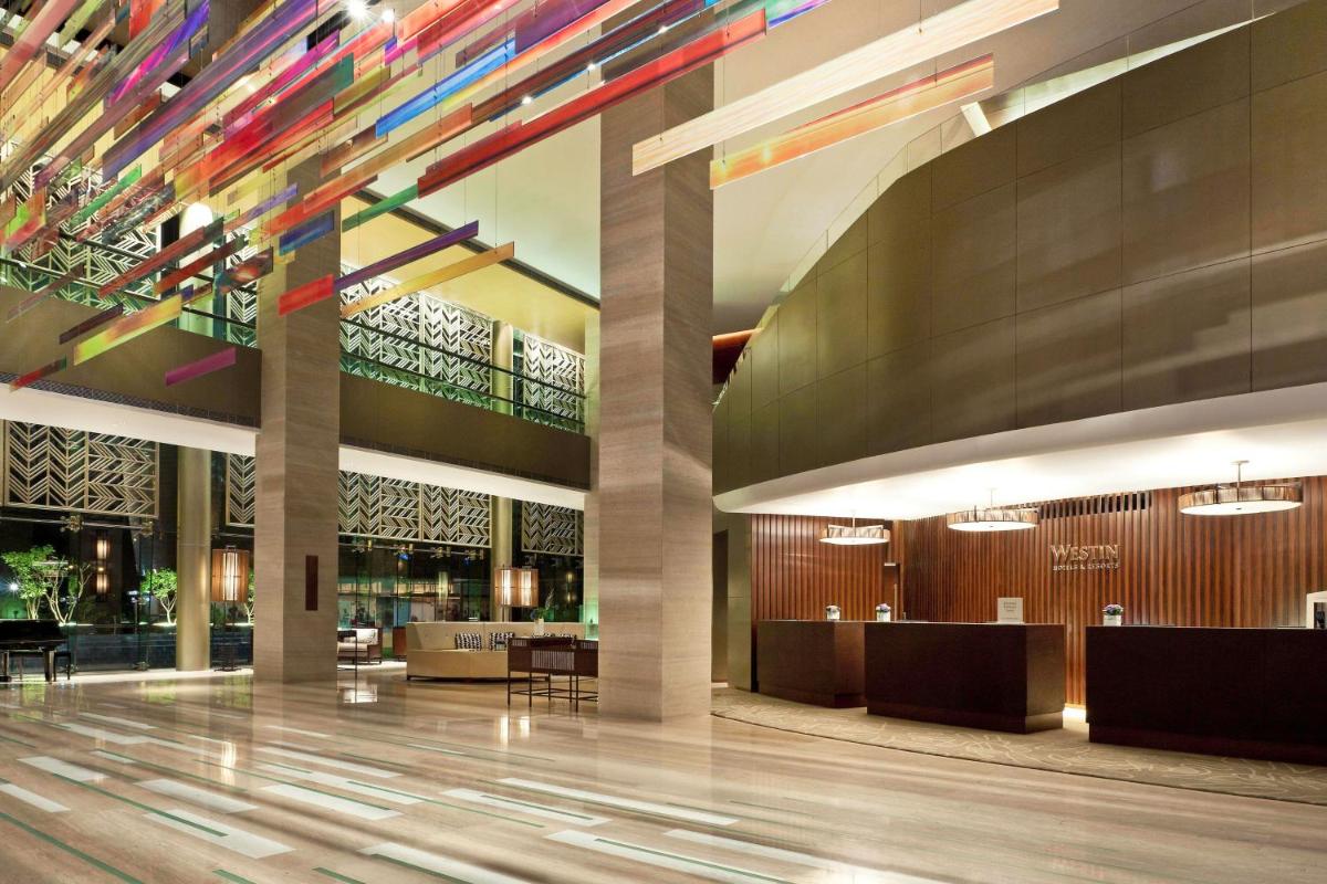 a lobby of a hotel with colorful lights at The Westin Gurgaon, New Delhi in Gurgaon