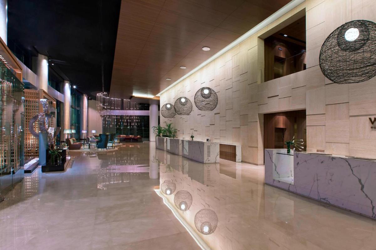 a lobby of a building with a lobbyasteryasteryasteryasteryasteryasteryasteryastery at The Westin Mumbai Garden City in Mumbai