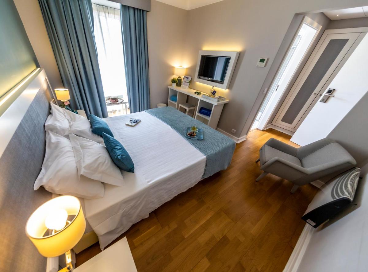 Uma cama ou camas num quarto em Grande Hotel das Caldas da Felgueira