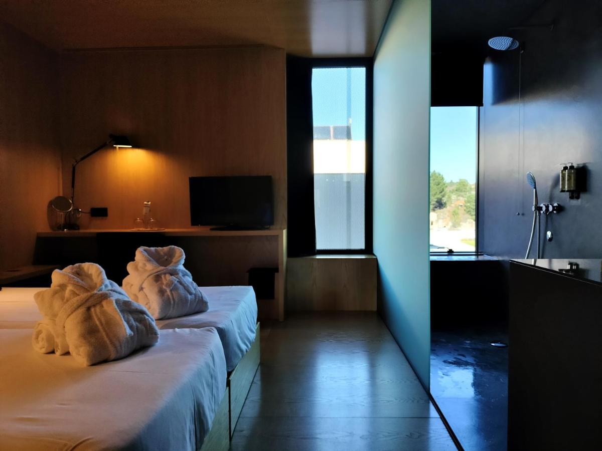 Uma cama ou camas num quarto em Cró Hotel Rural