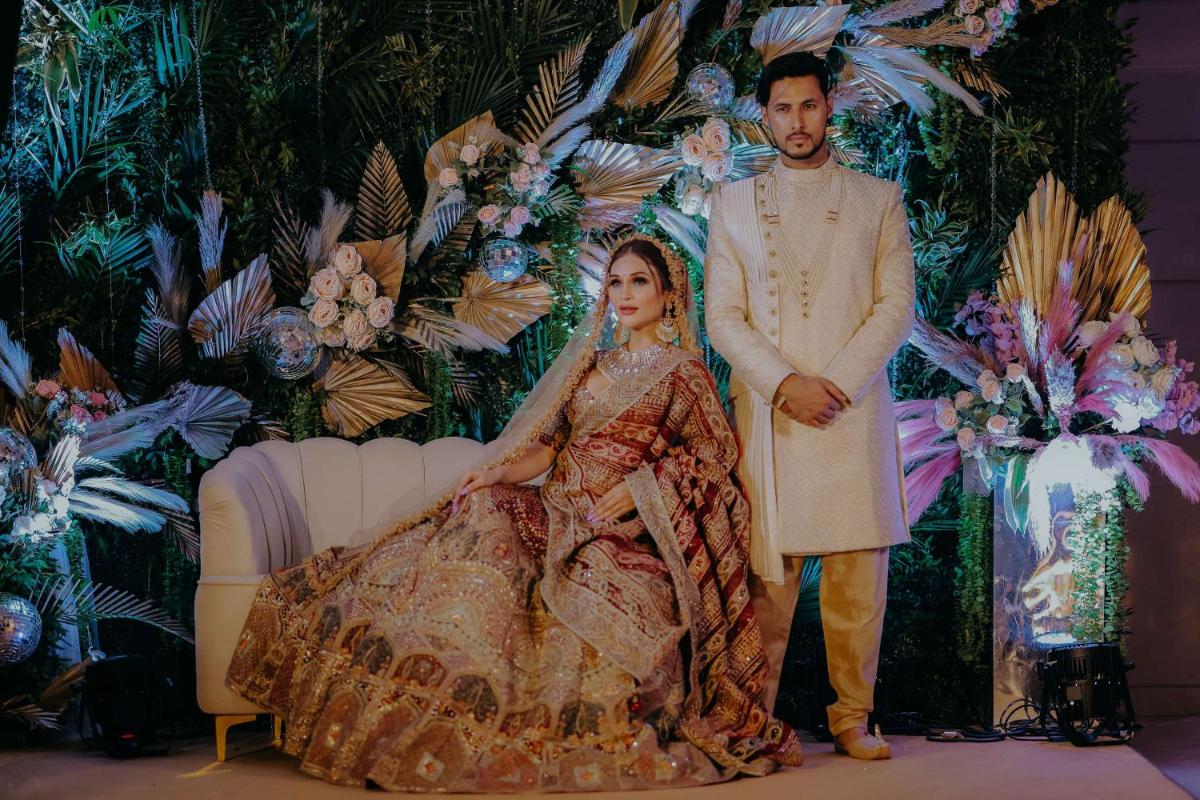 a man standing next to a woman in a dress at Radisson Blu Hotel Pune Kharadi in Pune