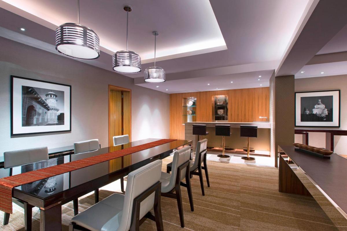 a conference room with a long table and chairs at Sheraton Grand Bangalore Hotel at Brigade Gateway in Bengaluru