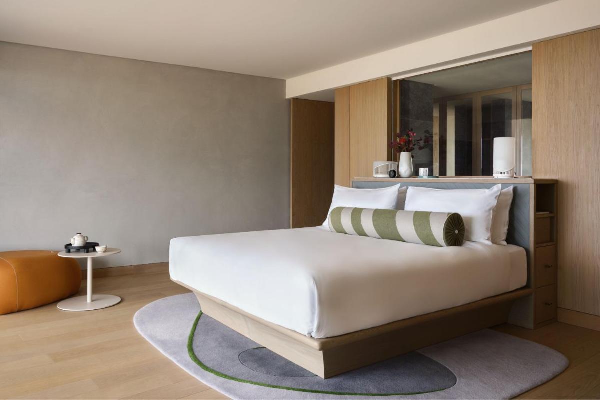 Uma cama ou camas num quarto em W Residences Algarve