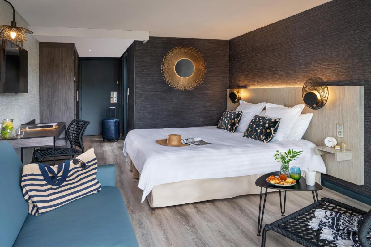 Un ou plusieurs lits dans un hébergement de l'établissement Hôtel Valdys Thalasso & Spa - les Pins