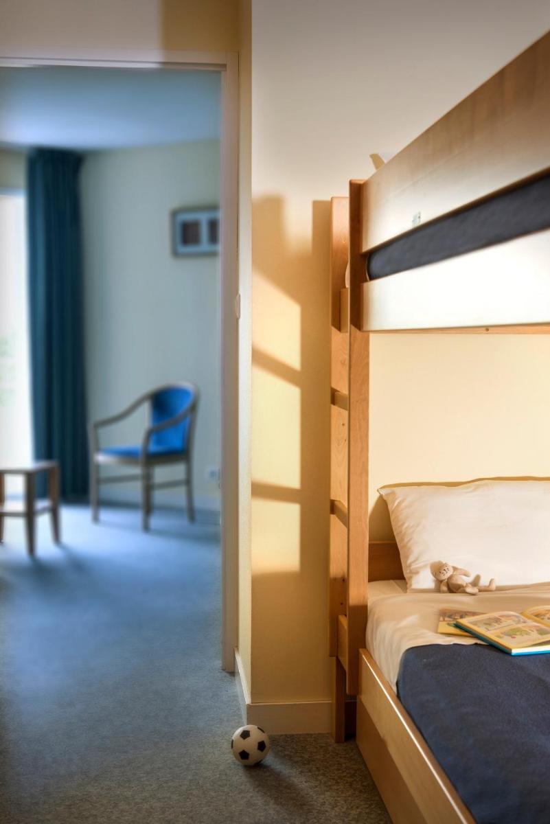 Un ou plusieurs lits dans un hébergement de l'établissement Résidence Valdys Thalasso & Spa - les Pins