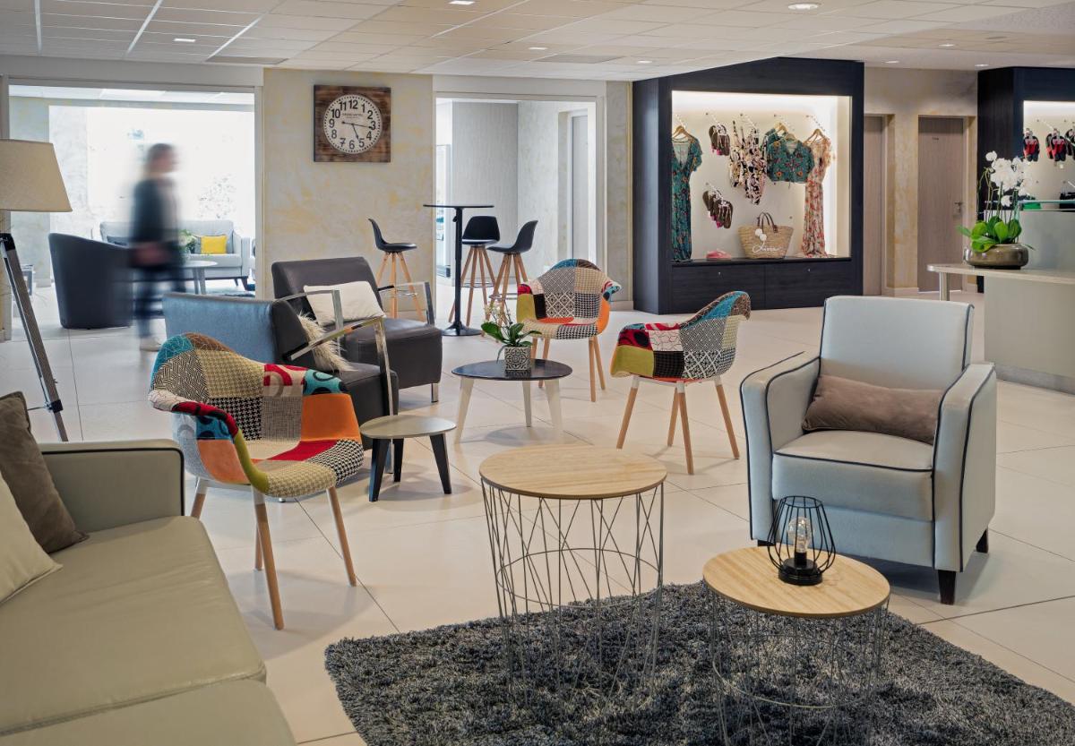 Coin salon dans l'établissement Résidence Valdys Thalasso & Spa - les Pins