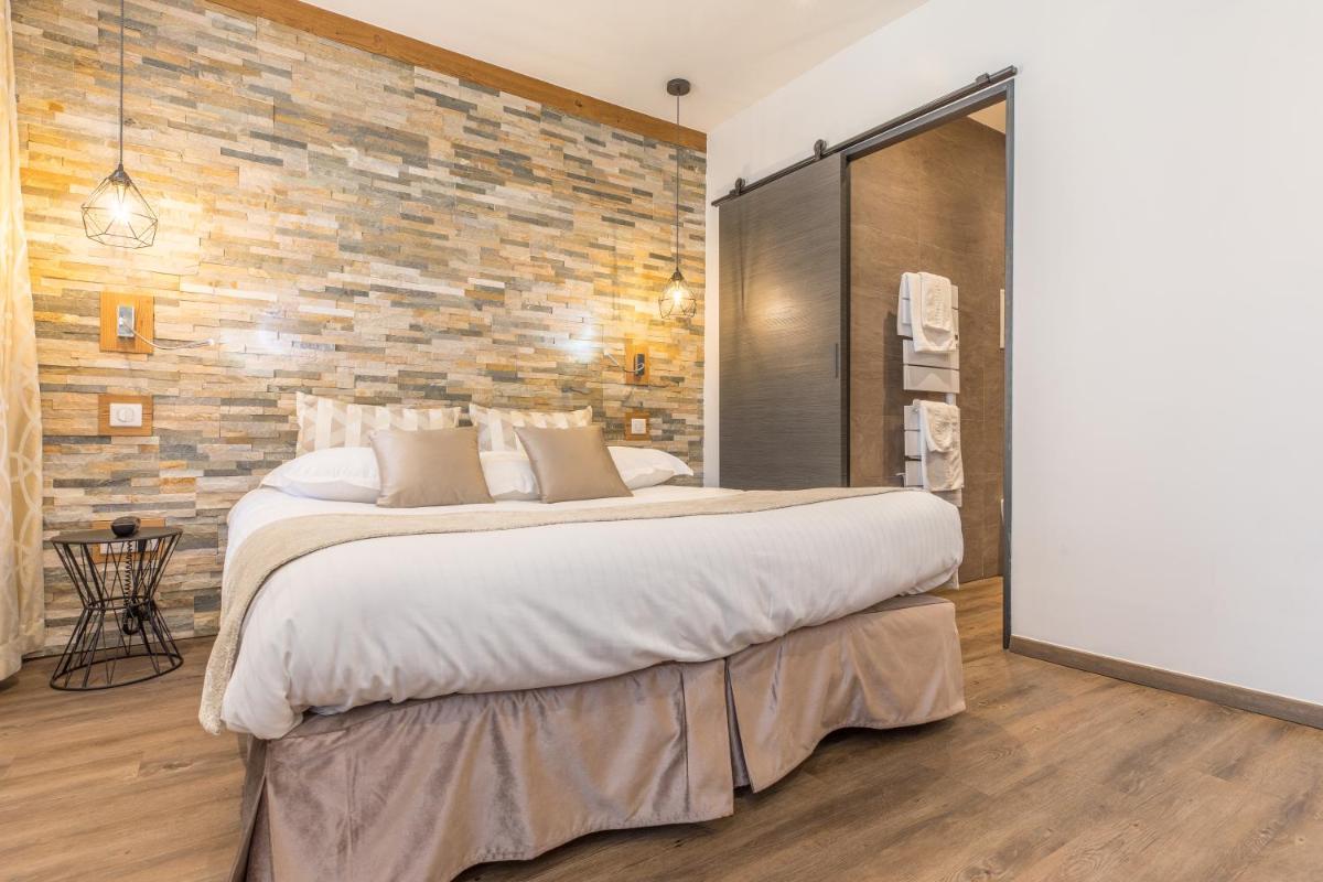 Un ou plusieurs lits dans un hébergement de l'établissement Hôtel des Princes, Chambéry Centre