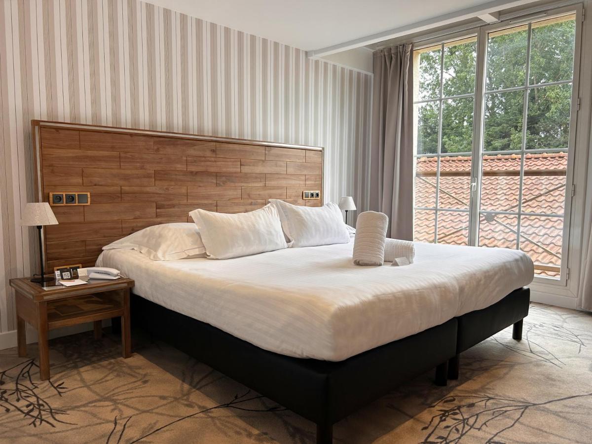 Un ou plusieurs lits dans un hébergement de l'établissement Le Grand Hôtel Le Touquet-Paris-Plage