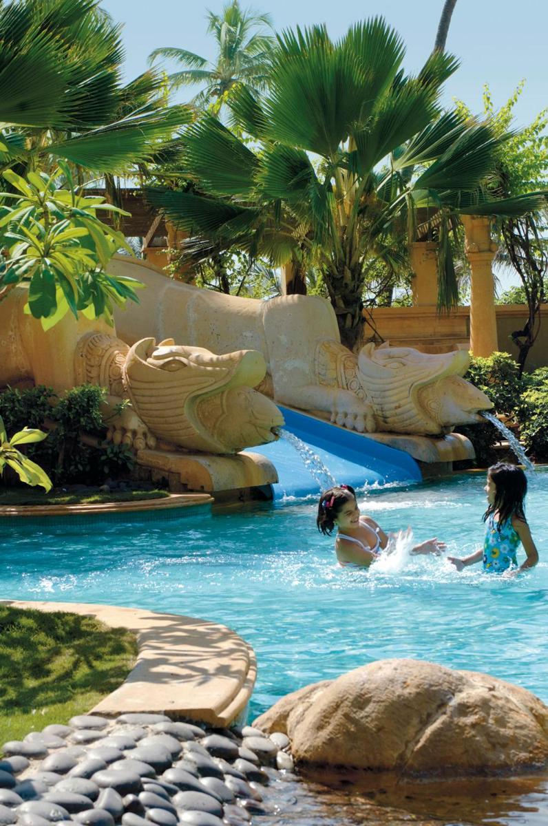 two girls swimming in a water slide at a resort at JW Marriott Mumbai Juhu in Mumbai
