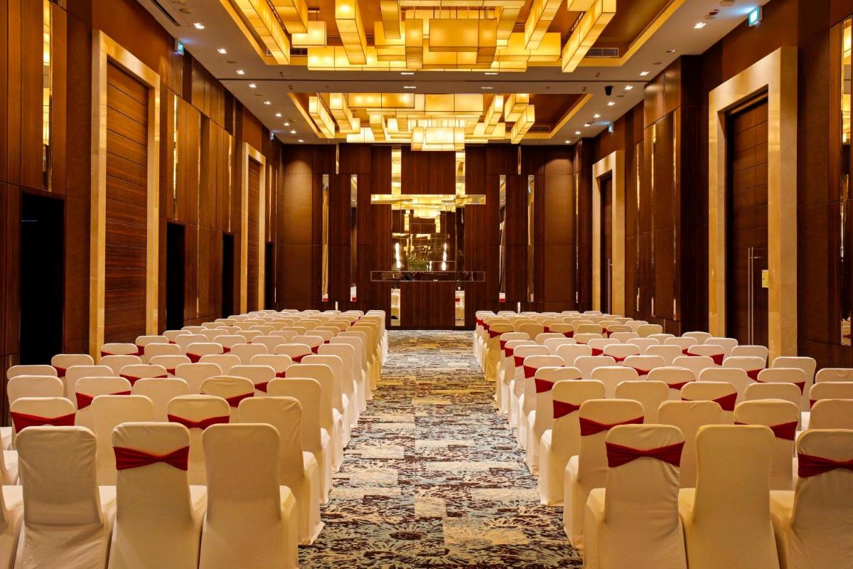 a large room with rows of chairs and a stage at Holiday Inn Chennai OMR IT Expressway by IHG in Chennai