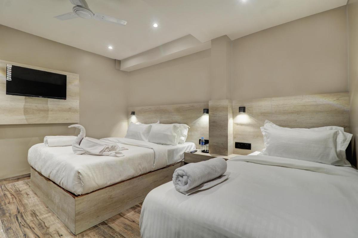 Hotel Embrace Inn Near Exhibition Center - Housity