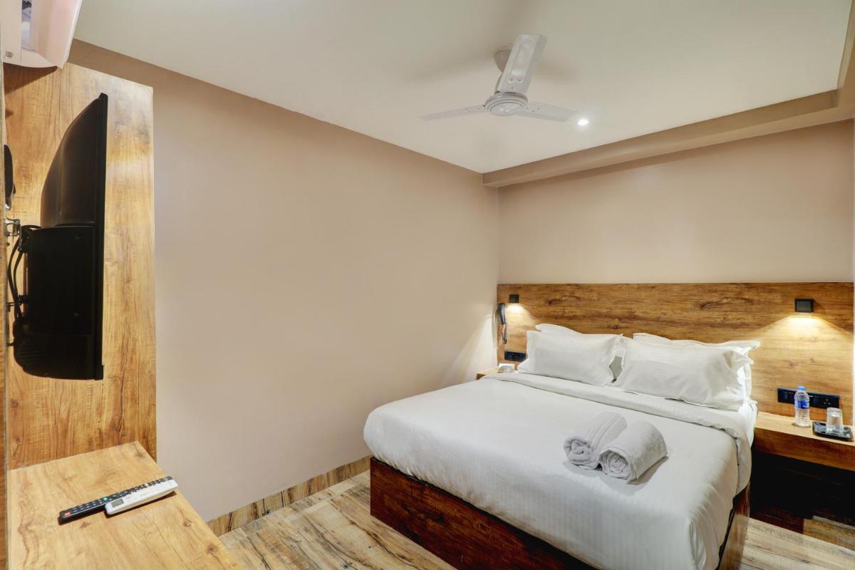 Hotel Embrace Inn Near Exhibition Center - Housity